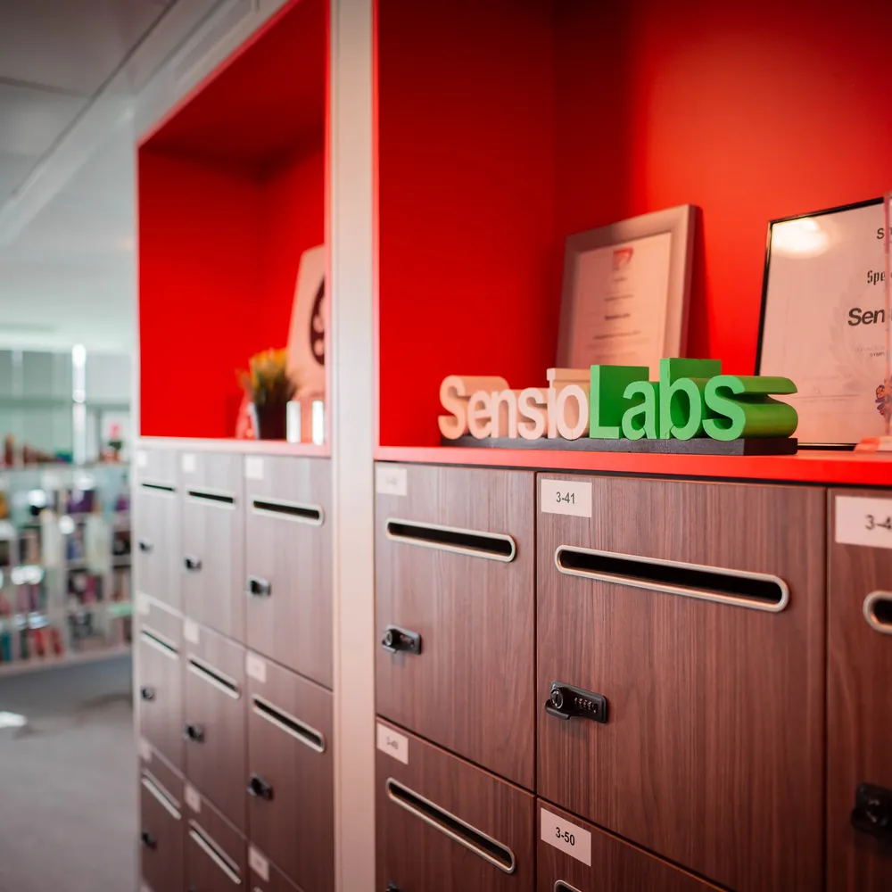 Orange shelves with the SensioLabs logo and trophies