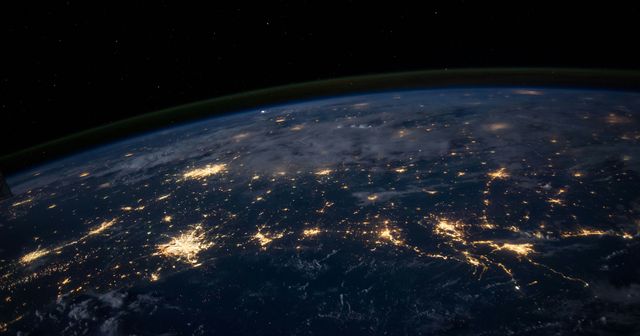 the surface of the earth seen from the space with city lights forming networks