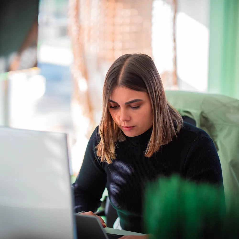 A young woman on her computer