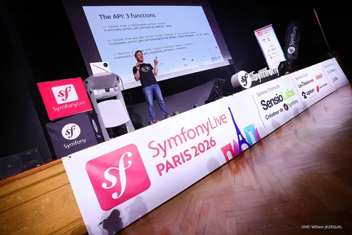 Nicolas Grekas standing on stage at SymfonyLive Paris 2026