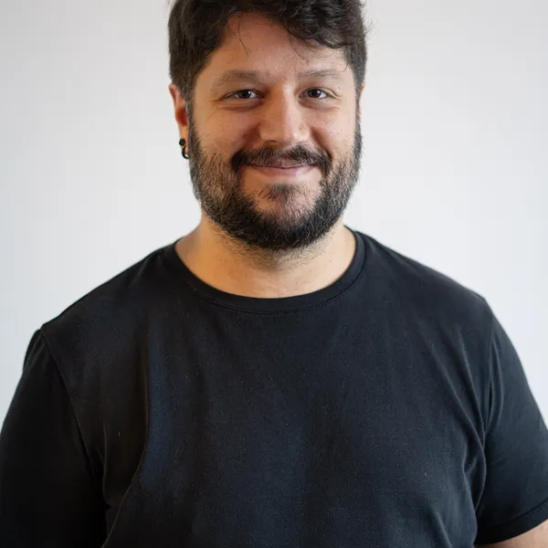 Benjamin Zaslavsky standing in a black t-shirt