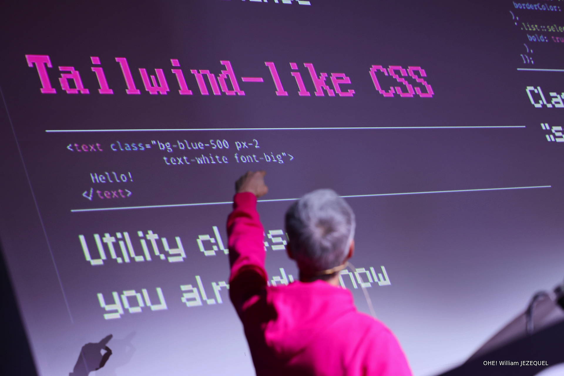Tailwind-like CSS on a screen with Fabien raising his hand to the screen