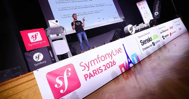 Nicolas Grekas standing on stage at SymfonyLive Paris 2026