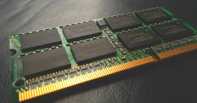 Black green and golden computer RAM on a dark ground