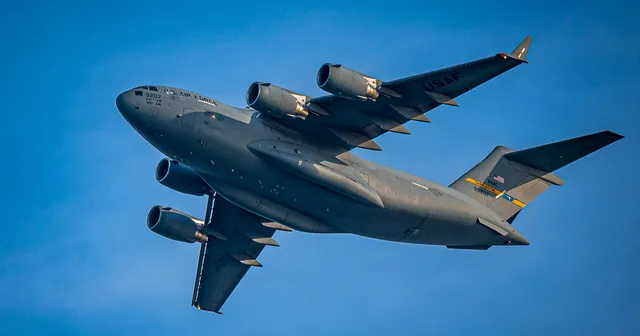 Grey Cargo Plane with a Blue Sky